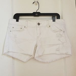 White distressed American eagle shorts
